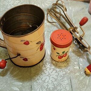 3pc vintage kitchen instruments hand mixer, salt shaker and sifter red